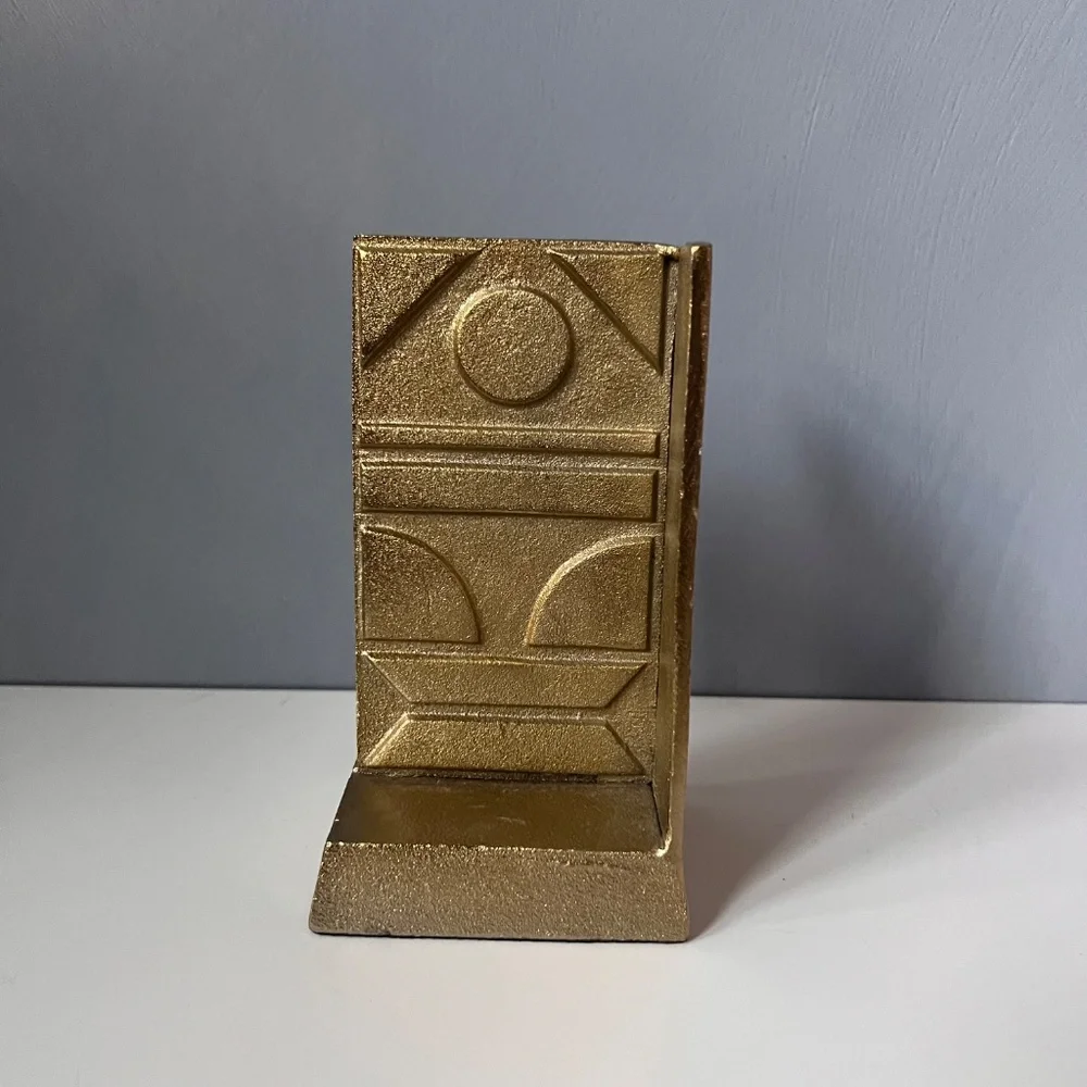 West Elm sculptural bookend in textured antique gold finish.